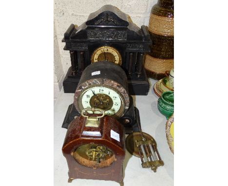 A black slate case striking mantel clock of architectural design, the movement impressed with cross arrows, 34cm high, 37cm w