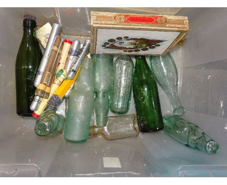 Four glass Codd bottles, including The Yacht Beverage Co. Ltd, Exeter, a Schweppes torpedo bottle, others, a Johnnie Walker S