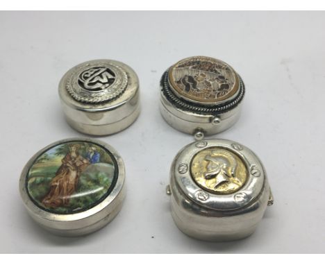Four Small circular silver boxes of circular shape with enamel and parcel gilt decoration (4)