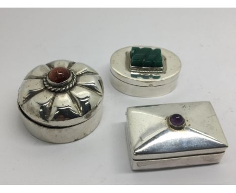 Three Continental silver box’s inset with amethyst cabochon carved green jade type stone and one other 3cm &gt;. (3)