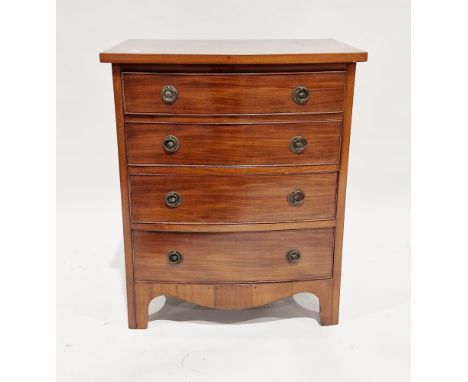 Small mahogany bowfronted chest of four long graduating cockbeaded drawers in the George III manner, the drawers with brass d