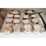 Two sets of six Coalport china coffee cans and saucers, early 20th century, with later replacements,