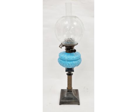 Late Victorian oil lamp with duplex burner, etched glass shade and funnel, above opaque blue glass reservoir moulded with ree