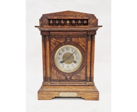 Early 20th century oak cased 8-day mantel clock, the gilt brass and silvered face having Arabic numerals, 36cm high
