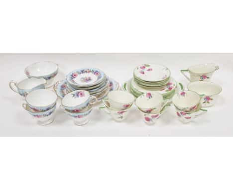 Royal Doulton Art Deco part tea-service, printed green marks, pattern no. V.1409, with pink and blue flowers within green lin