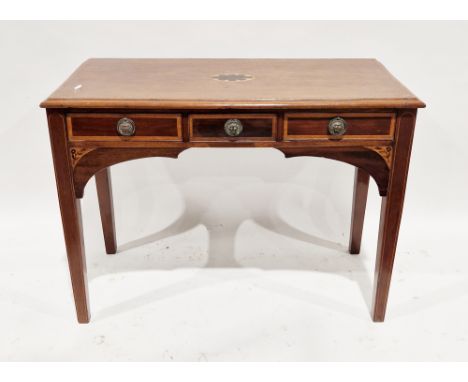 Edwardian Sheraton Revival mahogany and cross-banded desk/side table, the ogee moulded edged top over three drawers with drop