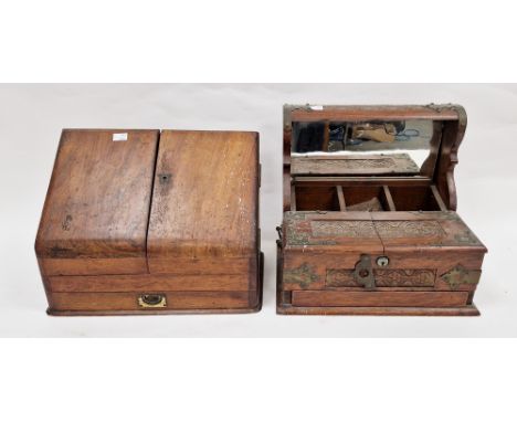 Edwardian oak tantalus, brass-mounted with hinged foliate carved front flaps opening to reveal compartmentalised interior, wi