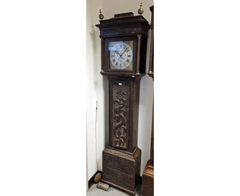 Elaborately carved 19th century oak longcase clock, the 30-hour movement with 11" square brass dial, chapter ring with roman 