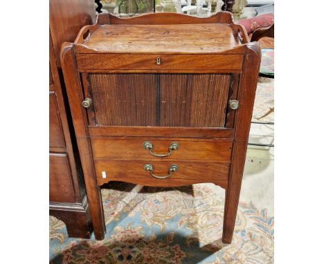 George III mahogany night stand of square form, the shaped galleried top with pierced carrying handles, tambour door to pot c