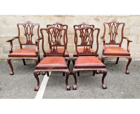 Set of six mahogany dining chairs in the Chippendale Revival manner, with ornately carved pierced splats, drop-in leatherette