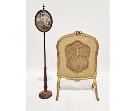 Early 20th century giltwood firescreen in the French manner with carved ribbon detail to top, needlework inlaid panel and rai