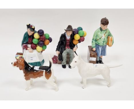 Two Beswick pottery models of dogs, a Royal Doulton model of the Old Balloon Seller and the Balloon Man and a figure of the B