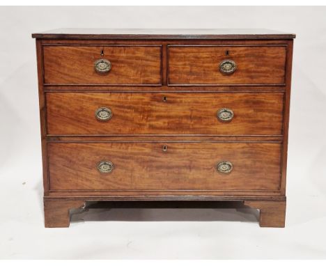 George III mahogany chest of two short and two long graduating cockbeaded drawers, the top with reeded sides, the drawers wit