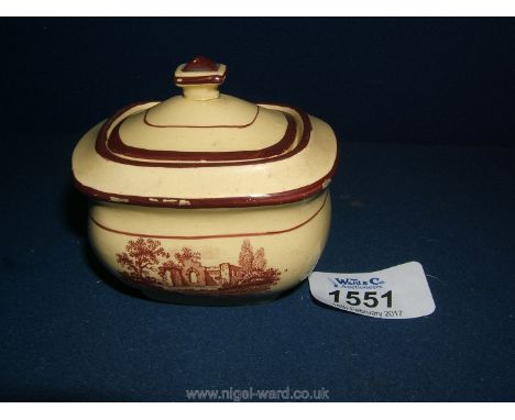 A very rare creamware miniature/toy tureen, first quarter 19th c., printed in red with two scenes of ruined buildings. Minor 