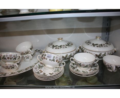 A Wedgwood ''Strawberry Hill'' bone china part Dinner service including two Vegetable dishes with lids, seven two-handled sou