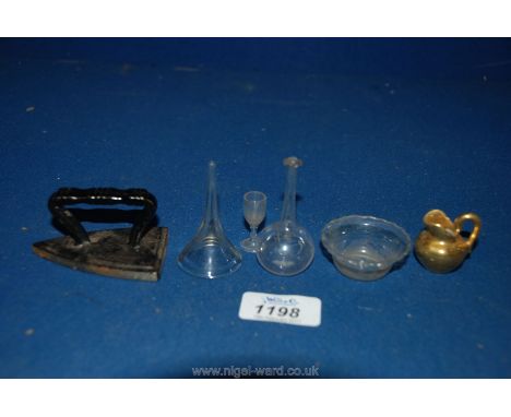 Three early miniature 'toy' objects, a tiny glass decanter mid 19th century, a glass funnel c. 1900 and a Victorian doll's fl