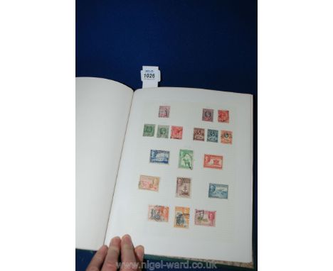 A Green Stanley Gibbons Stamp Album - British Empire and Commonwealth mix QV - QEII, with particular interest in Canada, Ceyl