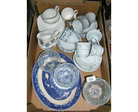 A box of china and glass including tea cups and saucers (various patterns),  blue and white Oval Plate, etc