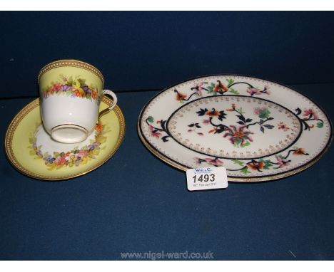 An oval Royal Worcester Sauce tureen Stand and a hand-painted Royal Worcester Tea cup and saucer with yellow band and gilt an
