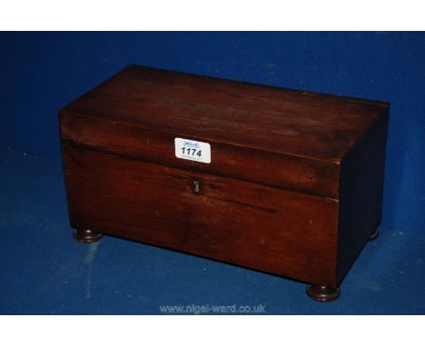 A Mahogany Tea Caddy having two compartments lined with red velvet, standing on four turned feet, a/f