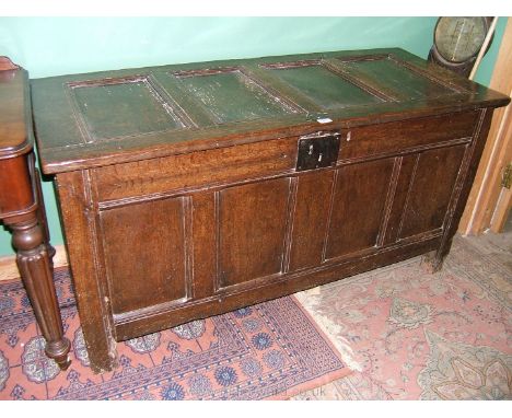 A mid 18th c. Oak four panel Coffer having four panel lid and front with moulded rails and stiles, iron lock plate, replaced 
