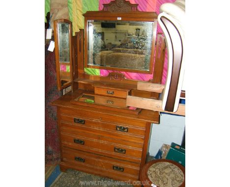 A good Edwardian Satinwood Dressing Chest having rectangular, bevel plated mirror with carved and pierced architectural style