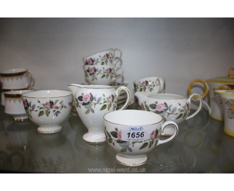 A Wedgwood bone china ''Hathaway Rose'' pattern Teaset comprising five cups, seven saucers, six plates, two milk jugs and sug