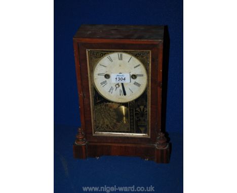 A small American style Mantle Clock with decorated glass door, 11" tall, having Rosewood veneered case