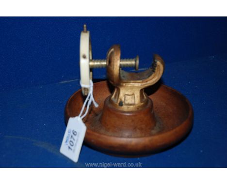 A Brass & Mahogany Nut Cracker in the Form of a Ship's Wheel.