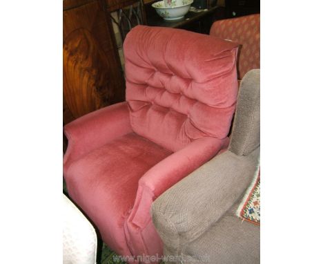 A modern electrically reclining Armchair, in Mulberry button back fabric upholstery