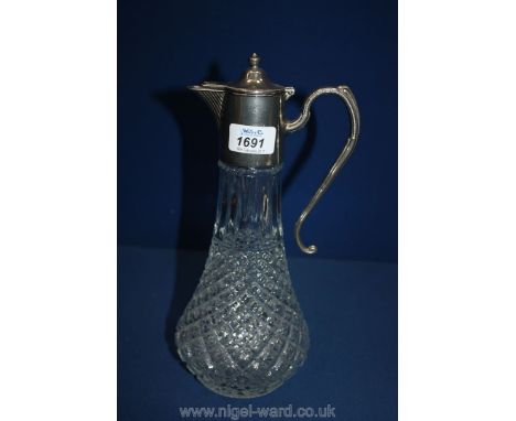 A Cut Glass Decanter with silver plating