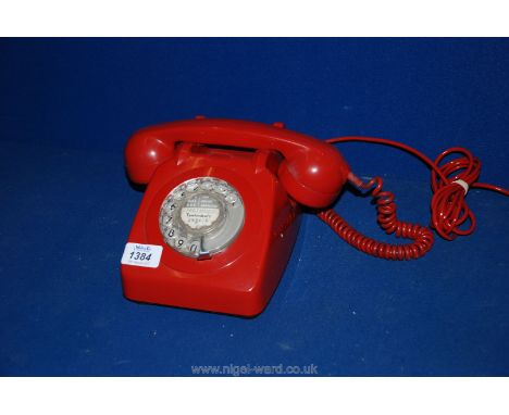 A vintage red dial Telephone, no. 706.