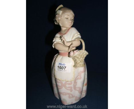 A Lladro figure of Spanish girl carrying basket of flowers, 10'' high