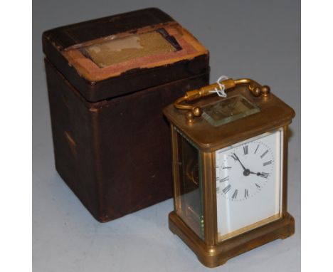 An early 20th century lacquered brass cased carriage clock, having enamelled dial with Roman numerals and visible platform le