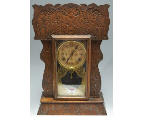 A late 19th century oak cased mantel clock by the Ansonia clock Company, having paper dial with Roman numerals and eight day 