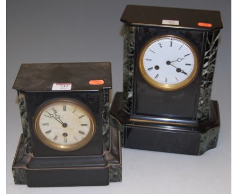 *An Edwardian black slate cased mantel clock having enamel dial and Roman numerals togethet with one other similar example (2