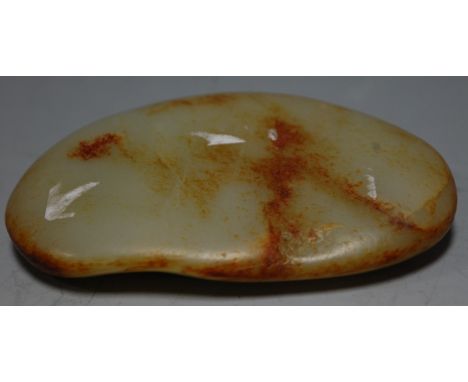 A russet jade pebble, w.11cm