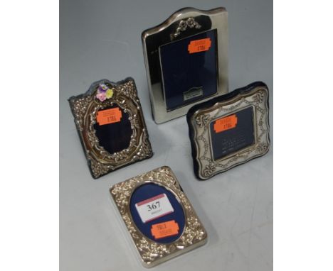 A modern silver mounted and blue felt-backed easel photograph frame, h.13cm; together with three modern Carr's of London silv