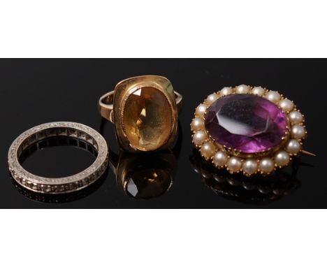 A 9ct gold citrine set ring together with a white metal sapphire set eternity ring and a Victorian yellow metal amethyst and 