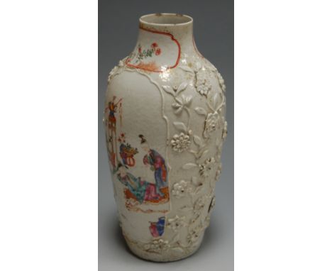 *A late 19th century Chinese porcelain vase, the central panel decorated with figures reading a scroll within relief floral b