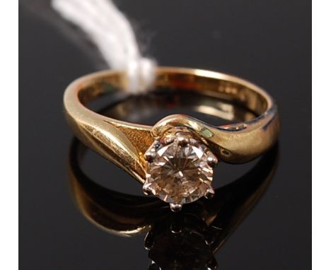 An 18ct gold diamond solitaire ring, the claw set brilliant weighing approx 0.6ct, 3.8g, size K