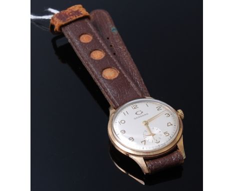 A Garrard gents 9ct gold cased wrist watch having a signed silver dial, subsidiary seconds dial, manual wind movement, the ba
