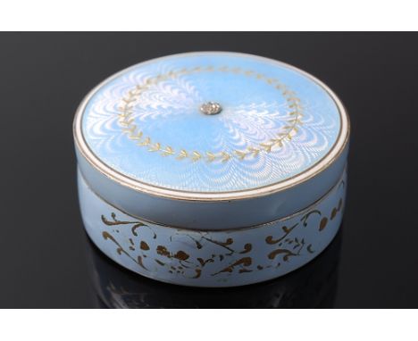 A cased silver  gilt and guilloche enamel powder box by The Goldsmiths & Silversmiths Company Ltd, the cover set with a small
