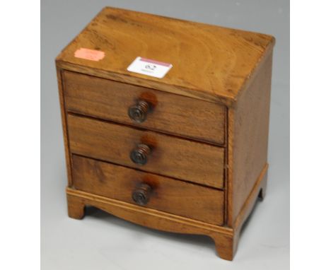 A 19th century mahogany and rosewood crossbanded apprentice piece chest of three short drawers on bracket feet, width 16cm