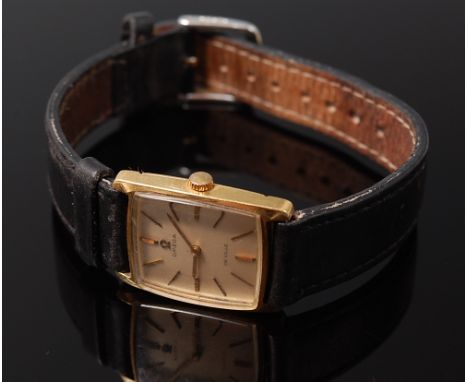 An Omega DeVille 18ct gold cased wrist watch having signed silvered dial, baton markers, and calibre 620 manual wind movement