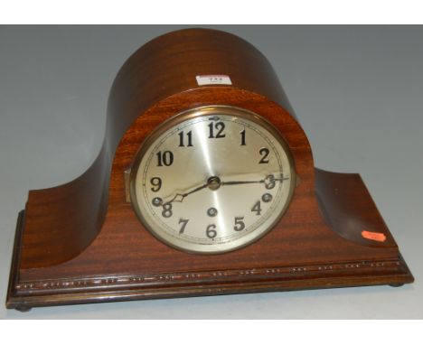 A 1920s mahogany cased mantel clock having a silver dial with Arabic numerals