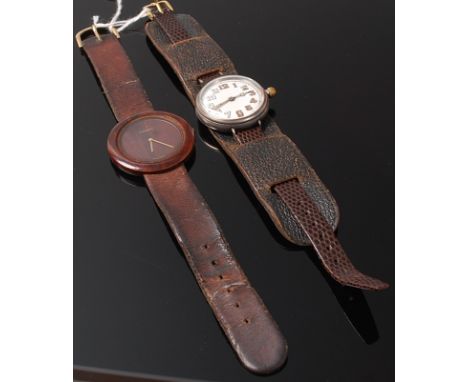 A Tissot quartz ladies watch having wooden bezel together with a vintage silver cased wrist watch with manual wind movement (