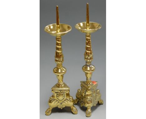 A pair of brass ecclesiastical style pricket candlesticks, height 40cm   Condition Report / Extra Information  Base metal sho