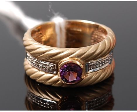 A modern heavy 9ct gold amethyst and diamond point set band ring, 7.8g, size O