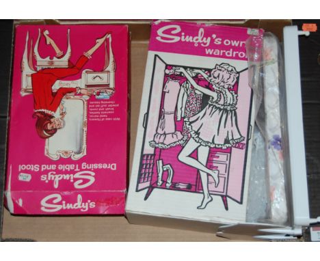 A boxed Sindy's dressing table and stool; together with Sindy's Own wardrobe and bed, and a Pedigree Sindy bedroom gift set 